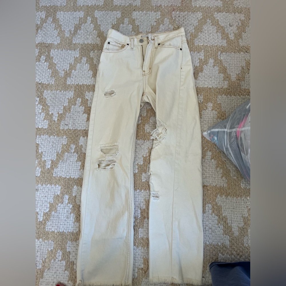 Tan ripped jeans